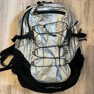 The North Face Silver and Black Backpack with Sporty Design
